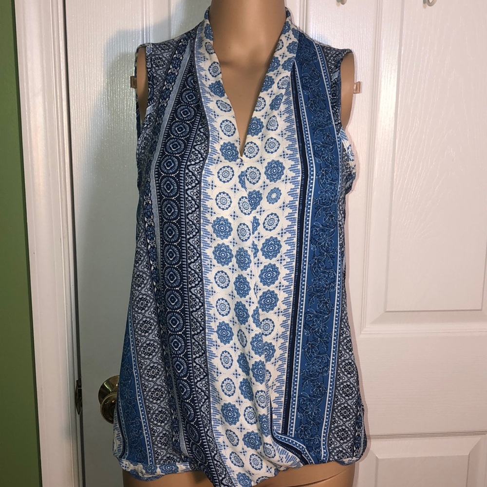 Versatile patterned sleeveless blouse.